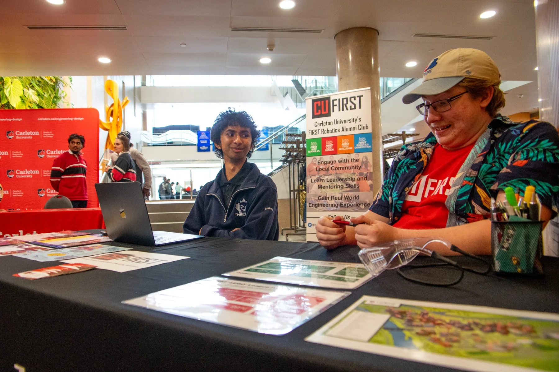 CU FIRST members at a Carleton outreach event